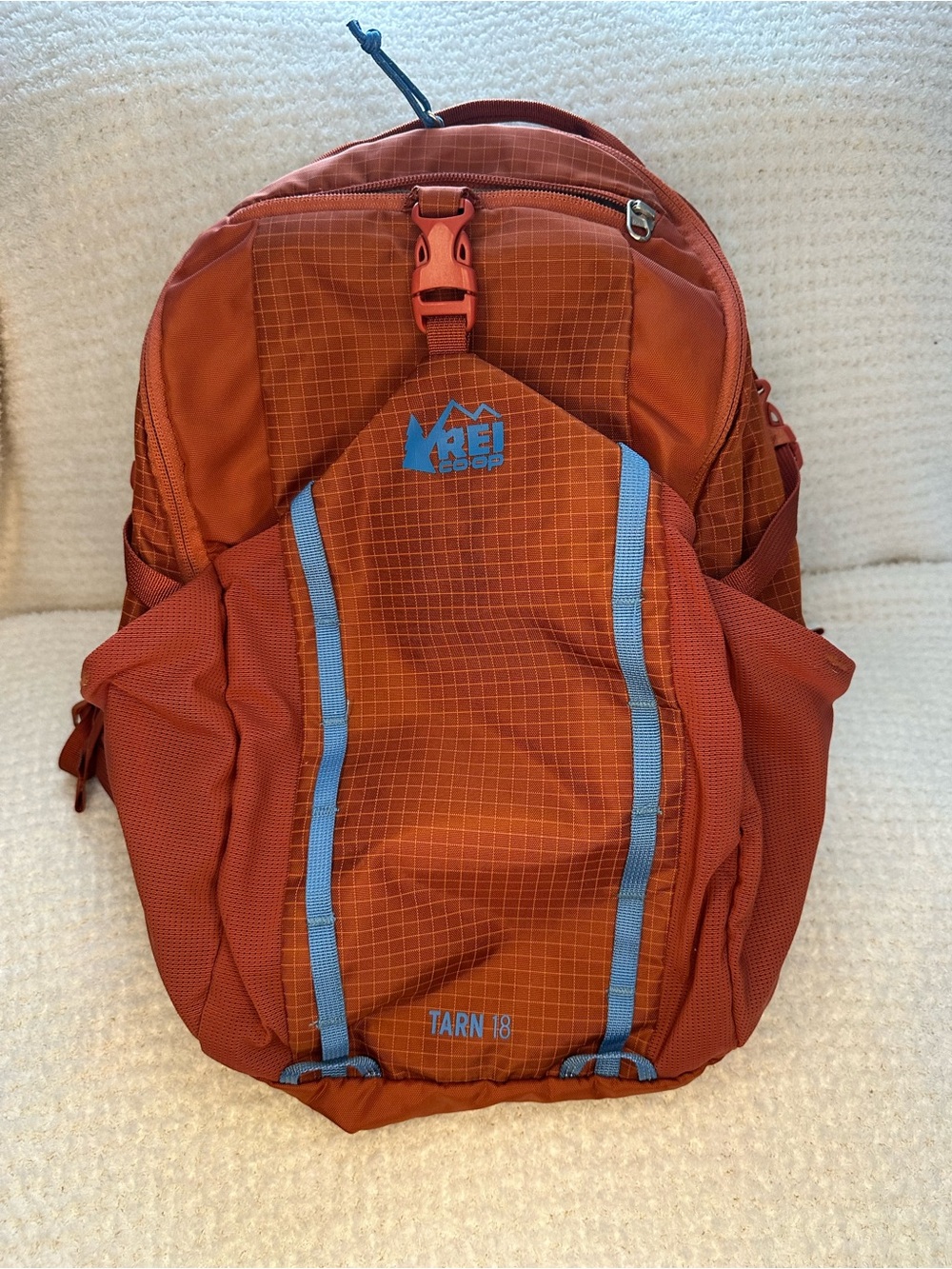 REI Tarn 18 Backpack in Rust Orange with Light Blue Accents